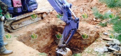 Копка котлована экскаватором